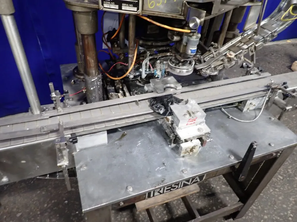 Resina Automatic Machinery 4 1/2" X 98" Capper - Sn30